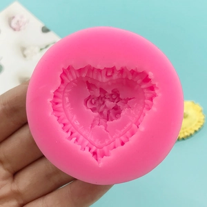 Pink round silicone mold featuring heart-shaped rose texture for chocolate and DIY crafts