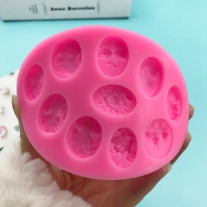 9-hole pink silicone mold with embossed butterfly and flower patterns for DIY fondant cake