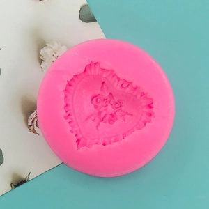 Detailed top view of pink silicone mold with rose heart relief for DIY cake or soap