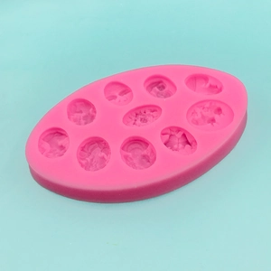 Pink silicone mold featuring 10 oval cameo relief patterns for DIY handmade crafts