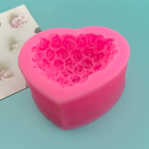 Pink heart-shaped silicone mold with rose flower texture for baking and cake decorating