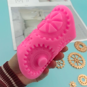 Pink silicone mold with industrial gear designs for DIY fondant cakes and chocolate crafts