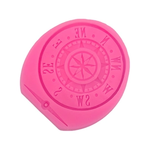 Pink silicone mold featuring intricate compass gear designs for DIY fondant and chocolate