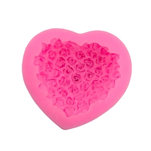 Pink heart-shaped silicone mold with detailed rose flower patterns for cake baking