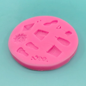 Pink silicone mold with beach themes like slippers and sun for cake decorating