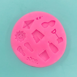 Macro detail of pink silicone mold with summer beach elements for fondant cake decorating