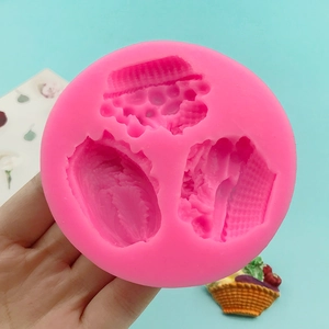 Pink silicone mold featuring cabbage corn and pumpkin shapes for cake decorating and crafts