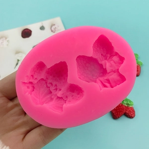 Pink silicone strawberry mold for fondant chocolate and wax with realistic textures