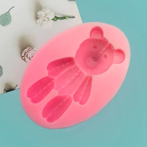 Macro detail of pink silicone bear mold for chocolate and DIY craft baking decoration