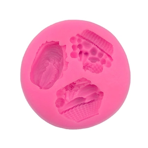 Pink round silicone mold with three vegetable and fruit cavities for cake baking and DIY crafts