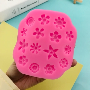 DIY rose pink silicone mold featuring various small flower shapes for cake decorating
