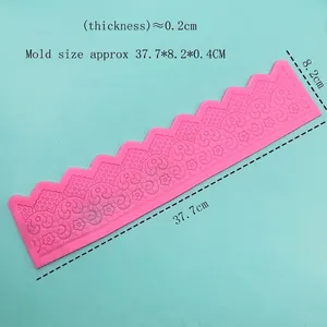 Pink silicone cake lace mold with floral scroll texture for fondant decoration