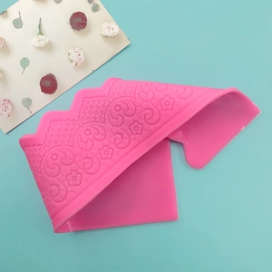 Pink silicone lace fondant mold with intricate crown floral pattern for cake decoration