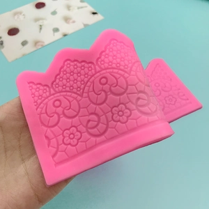 Pink silicone lace border mold for fondant cakes with intricate floral and mesh patterns