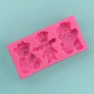 Close-up of pink silicone mold featuring three distinct cute teddy bear shapes