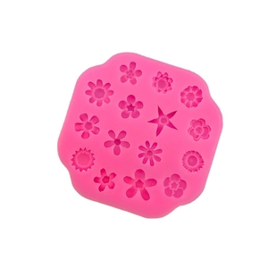 Pink silicone mold featuring 15 assorted flower and star shapes for DIY cake decorating