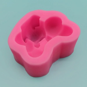 Pink dog bone silicone mold for handmade soap, chocolate, and cake decorating tools