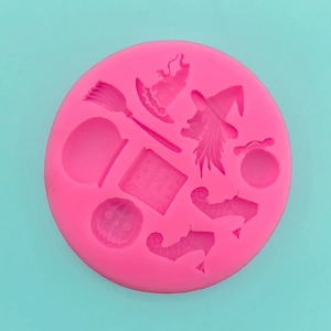Pink silicone Halloween mold with witch hat, pumpkin and wizard book patterns