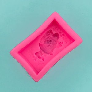 Detailed macro view of pink silicone mold with 3D Santa Claus shape for DIY baking