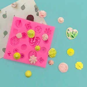 Pink silicone mold for heart and flower shapes used in fondant, chocolate, or clay crafting