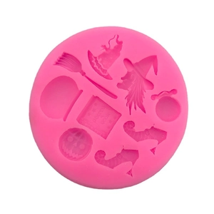 Pink silicone mold featuring Halloween witch hats pumpkins and spell book shapes