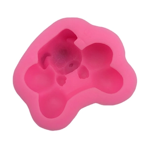 Pink silicone mold featuring cute dog bone shapes for DIY baking and handmade soaps
