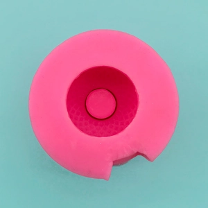 Top view of pink silicone vase mold featuring a cylindrical groove and side notch cutout
