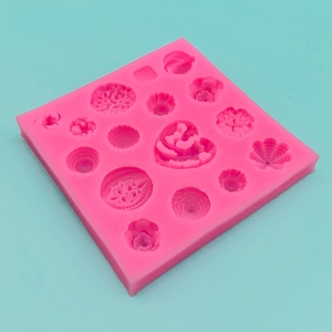 Pink silicone DIY mold featuring heart and various flower patterns for fondant and clay