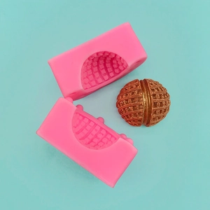 3D walnut-shaped silicone mold for mousse and chocolate baking on a cyan background