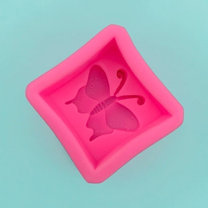 Macro shot of 3D butterfly silicone mold with detailed textures for fondant and soap