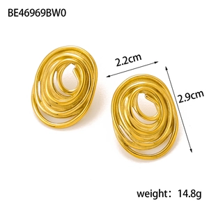 Detailed view of matte gold oval spiral earrings with dimensions 2.2cm x 2.9cm