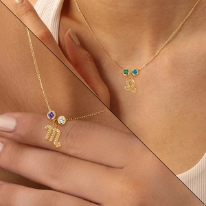 Golden zodiac pendant necklaces with Scorpio and Leo symbols and colorful gemstones