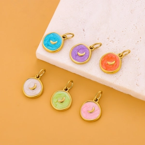 Detail of six colorful enamel moon pendants in gold finish for DIY jewelry making