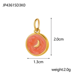 Detailed view of 2.0cm round moon pendant with orange enamel and gold metal frame