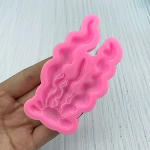 Pink silicone mold with coral seaweed pattern for ocean cake decorating and fondant baking