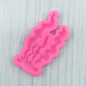 Detailed macro view of pink silicone seaweed coral mold for fondant cake decoration
