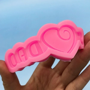 Pink silicone DIY mold with DAD letters and heart spiral for Father's Day cake baking