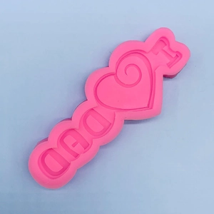 Detailed view of pink silicone mold with I Heart DAD letters for cake and DIY crafts