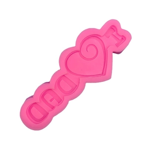 Pink silicone mold featuring I Love Dad lettering and heart for Father's Day cake baking