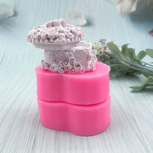 Pink heart-shaped silicone mold with floral relief for making decorative jewelry boxes