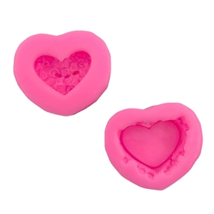 Two-piece heart shaped pink silicone molds for cake decorating and DIY crafts