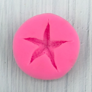 Detailed top view of pink starfish silicone mold for fondant and DIY resin crafts