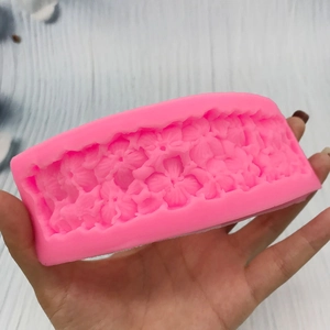 Pink silicone clover flower strip mold for fondant cake decorating and chocolate crafting