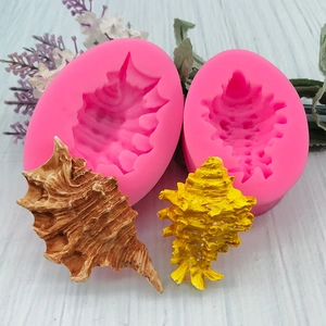 Pink silicone marine shell molds for chocolate fondant DIY with detailed spiral textures