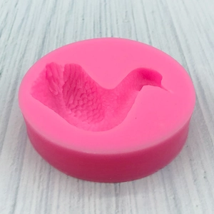 Pink silicone mold with detailed swan shaped cavity for DIY chocolate mousse and cake