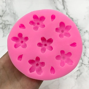 Pink silicone cherry blossom mold with five-petal flower and petal shapes for cake decor