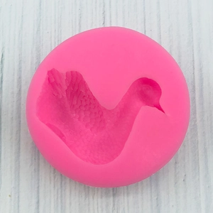 Detailed macro view of pink silicone duck mold for fondant and chocolate DIY crafts