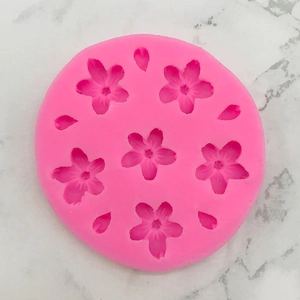 Pink silicone mold featuring cherry blossom petals for fondant and chocolate making