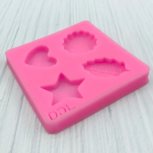 Stampo in silicone rosa con forme di cuore stella foglia e fiore per pasticceria