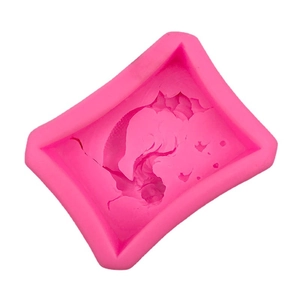 Pink silicone mold featuring intricate mermaid or bird pattern for DIY soap and chocolate